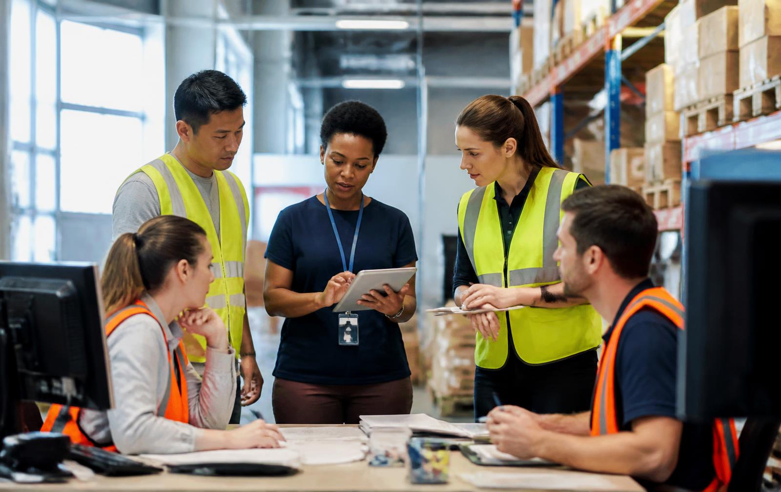 Logistics team coordinating shipments at a distribution facility